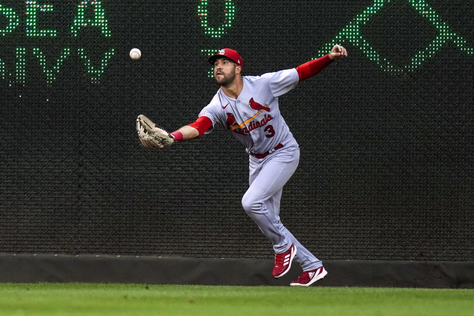 St. Louis Cardinals right fielder Dylan Carlson grabs the ball on a triple by Washington Nationals' Luis Garcia during the fourth inning of a baseball game at Nationals Park, Tuesday, June 20, 2023, in Washington. (AP Photo/Alex Brandon)