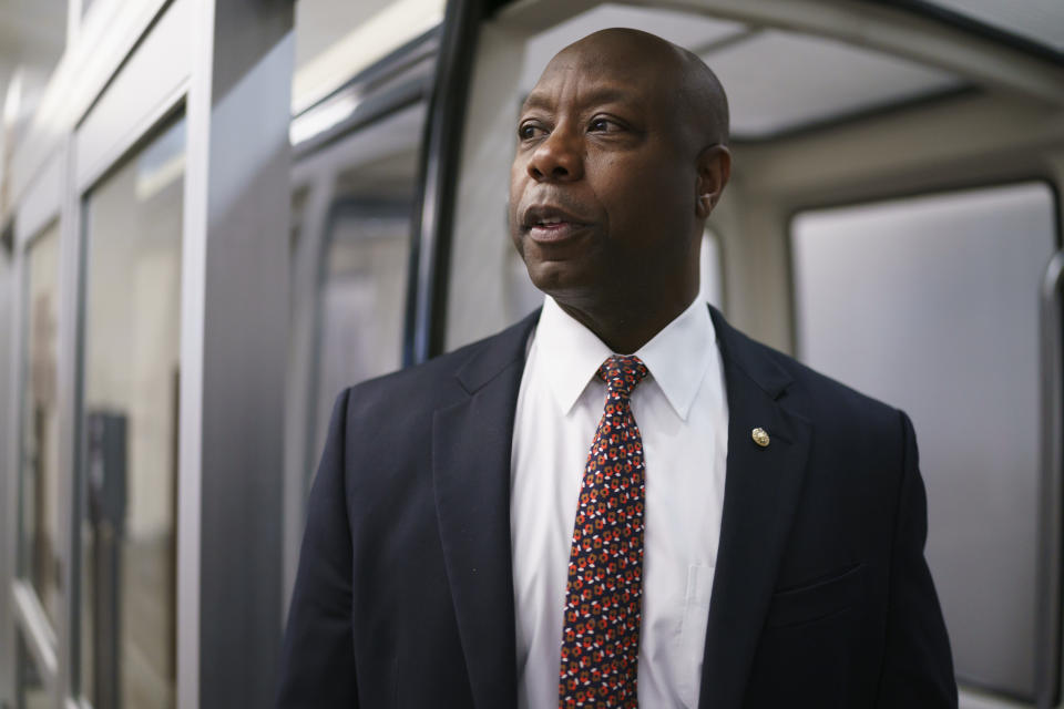 Sen. Tim Scott, R-S.C., arrives as senators go to the chamber for votes ahead of the approaching Memorial Day recess, at the Capitol in Washington, Thursday, May 27, 2021. Senate Republicans are ready to deploy the filibuster to block a commission on the Jan. 6 insurrection, shattering chances for a bipartisan probe of the deadly assault on the U.S. Capitol and reviving pressure to do away with the procedural tactic that critics say has lost its purpose. (AP Photo/J. Scott Applewhite)