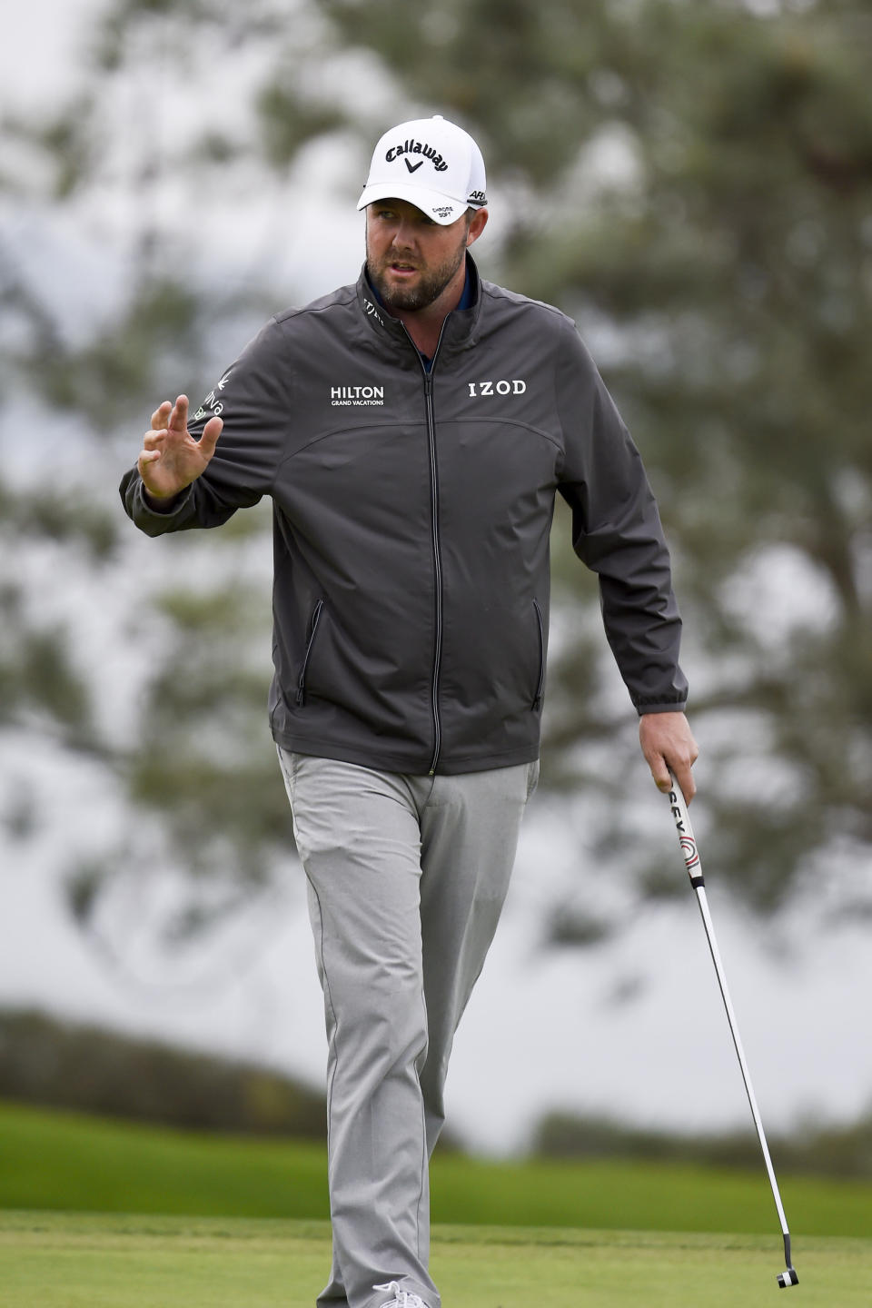 Marc Leishman of Australia waves after putting on the fourth hole of the South Course at Torrey Pines Golf Course during the final round of the Farmers Insurance golf tournament Sunday, Jan. 26, 2020, in San Diego. (AP Photo/Denis Poroy)