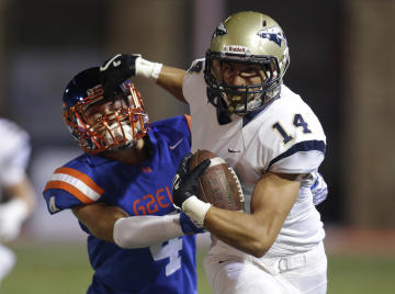 Some of the country's top high school football players could face off in a State Champions Bowl Series this December. (AP Photo/Isaac Brekken)