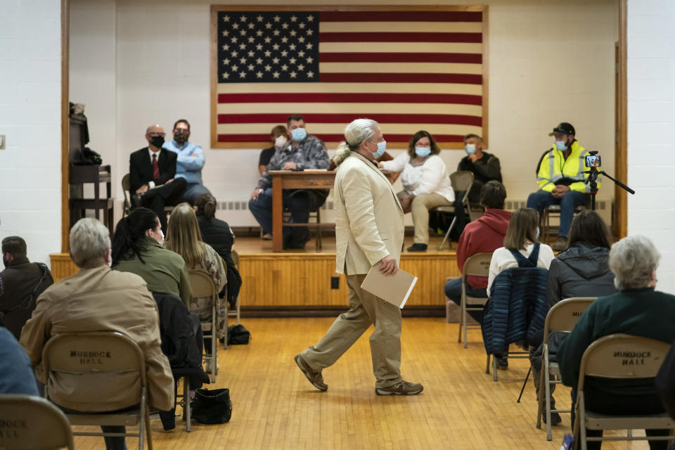 Lawyer and member of the Asatru Folk Assembly Allen Turnage returns to his seat, Wednesday, Oct. 14, 2020, in Murdock, Minn., after taking questions from the public. (Renee Jones Schneider / Star Tribune via AP)