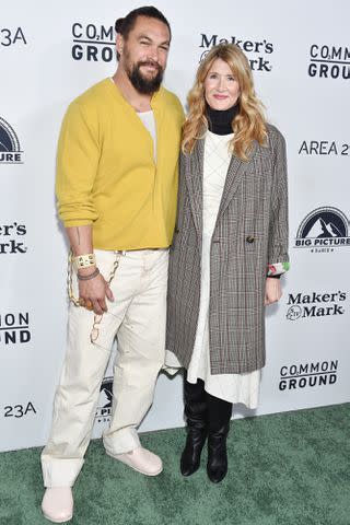 <p>Gregg DeGuire/Variety via Getty</p> Jason Momoa and Laura Dern on January 11, 2024 in Beverly Hills, California.