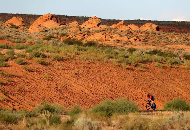 <span class="article__caption">Competitors ride through bike leg of the 2021 Ironman 70.3 World Championship race in St. George, Utah--before a storm swept through.</span> (Photo: Ezra Shaw/Getty Images)