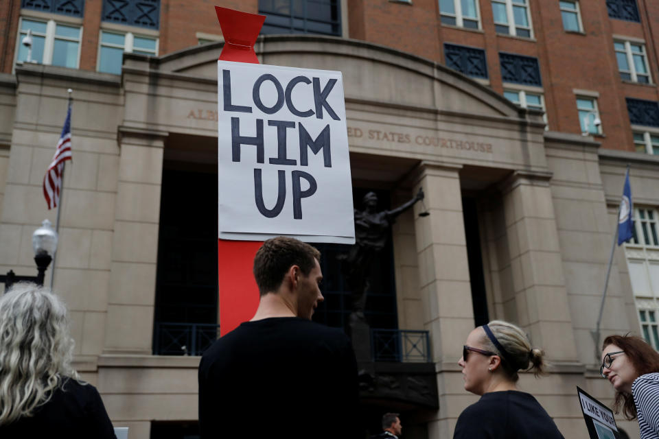 <p>Protesters gather outside the US District Courthouse ahead of Former Trump campaign manager Paul Manafort arriving for the opening day of his trial on bank and tax fraud charges stemming from Special Counsel Robert Mueller’s investigation into Russian meddling in the 2016 presidential election, in Alexandria, Va., July 31, 2018. (Photo: Aaron P. Bernstein/Reuters) </p>