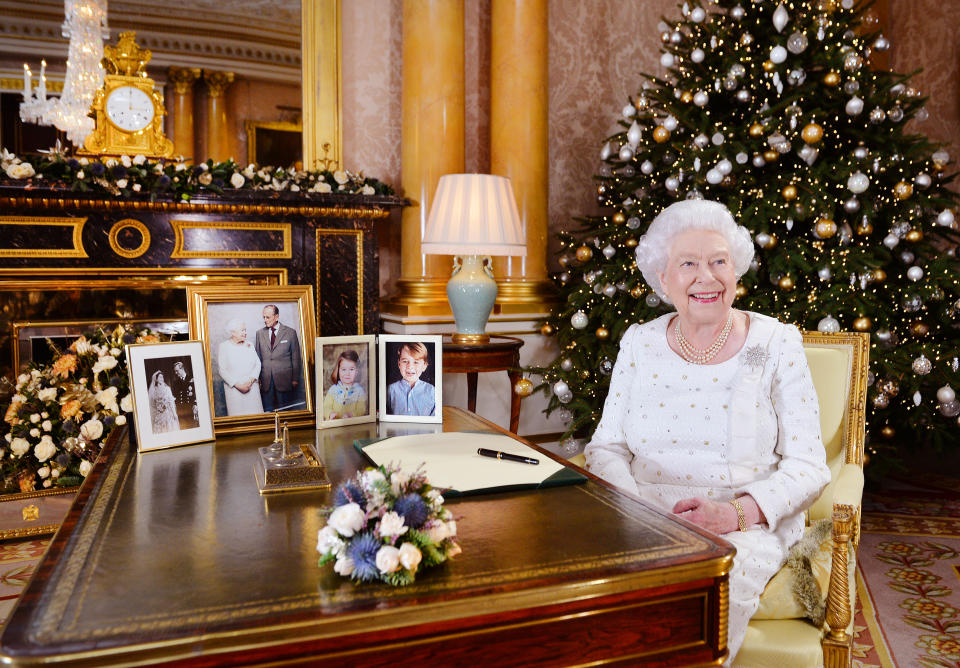 LONDON, UNITED KINGDOM -  In this undated image supplied by Sky News, Queen Elizabeth II sits at a desk in the 1844 Room at Buckingham Palace, after recording her Christmas Day broadcast to the Commonwealth at Buckingham Palace, London.  (Photo by John Stillwell - WPA Pool/ Getty Images)