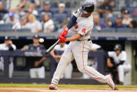 Boston Red Sox's Rafael Devers hits a home run during the first inning of the team's baseball game against the New York Yankees on Saturday, July 16, 2022, in New York. (AP Photo/Frank Franklin II)