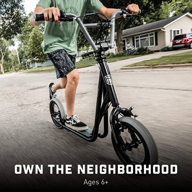 kid riding black Mongoose expo youth scooter