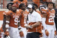 FILE - In this Friday, Nov. 27, 2020, file photo, Texas head coach Tom Herman, center, walks on the sideline during the second half of an NCAA college football game against Iowa State in Austin, Texas. Herman batted away questions about his future with the program on Monday, Nov. 30, 2020, and insisted on trying to keep the focus on the Longhorns' players trying to win their last two games of the season. (AP Photo/Eric Gay, File)