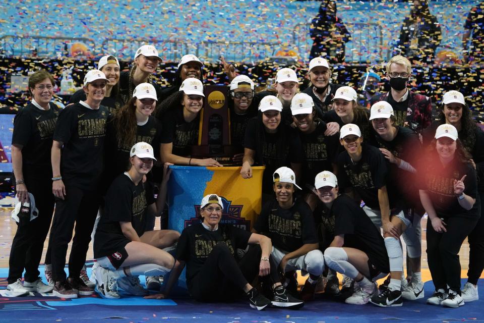 Stanford Cardinal players and head coach Tara VanDerveer pose with the championship trophy after the national championship game of the women's Final Four of the 2021 NCAA Tournament against the Arizona Wildcats at Alamodome. Stanford defeated Arizona 54-53 to win first time since 1992.