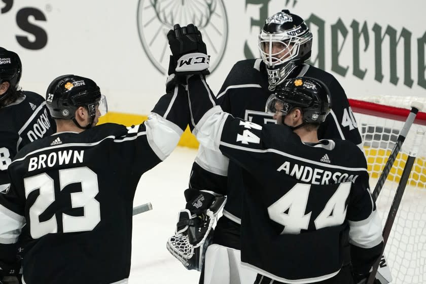 Los Angeles Kings right wing Dustin Brown, left, and defenseman Mikey Anderson.