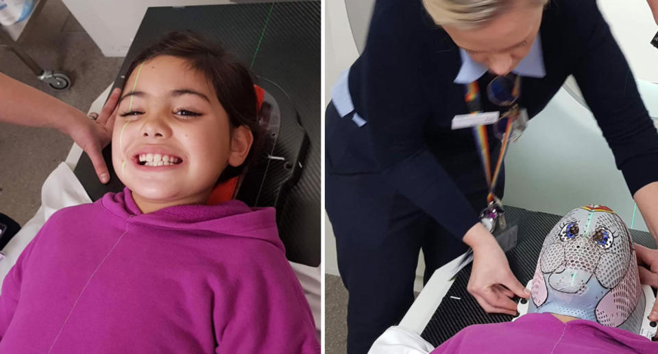 Photos of Mia, from Queensland, being fitted for a mask with a cute image of an elephant. 