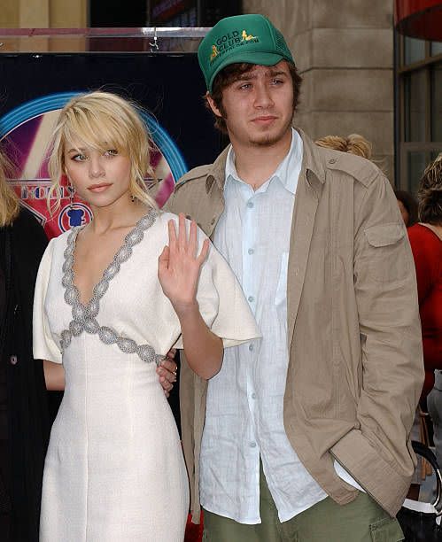 <p>Older brother Trent has appeared in a few of the twin's videos, but he prefers to keep a low profile and private life. Here, he's shown with Ashley at a Hollywood event. </p>
