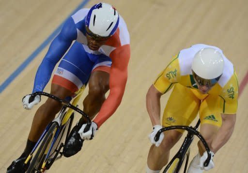 France's Gregory Bauge (L) and Australia's Shane Perkins (R) compete in the London 2012 Olympic Games men's sprint semi-final cycling event at the Velodrome in the Olympic Park in East London on August 6, 2012