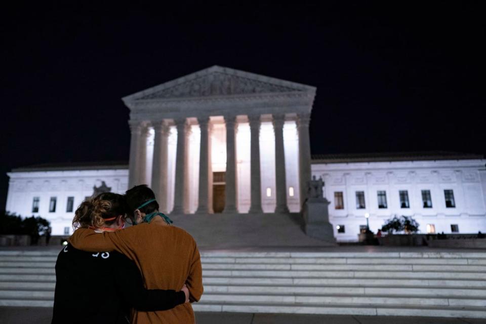 <div class="inline-image__caption"><p>Two women embraced in front of the Supreme Court building, paying their respects to Justice Ruth Bader Ginsburg after she died, in Washington, DC, on September 18, 2020.</p></div> <div class="inline-image__credit">Alex Edelman/Getty</div>