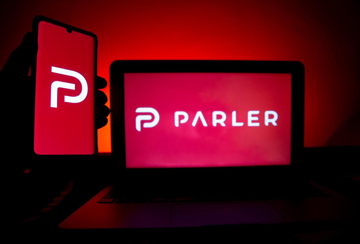 A photo illustration shows the logo of Conservative social media application (app) Parler on a computer and mobile telephone screen, in Paris, France, on 11 January 2021 ((EPA))