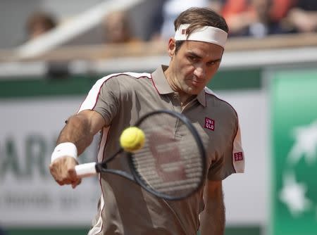 May 26, 2019; Paris, France; Roger Federer (SUI) hits the ball during his match against Lorenzo Song (not pictured) on day one of the 2019 French Open at Stade Roland Garros. Mandatory Credit: Susan Mullane-USA TODAY Sports