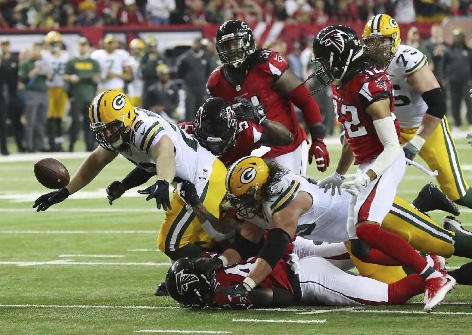 Green Bay Packers' Aaron Ripkowski fumbles the ball during the first half of the NFL football NFC championship game against the Atlanta Falcons, Sunday, Jan. 22, 2017, in Atlanta. (Curtis Compton/Atlanta Journal-Constitution via AP)