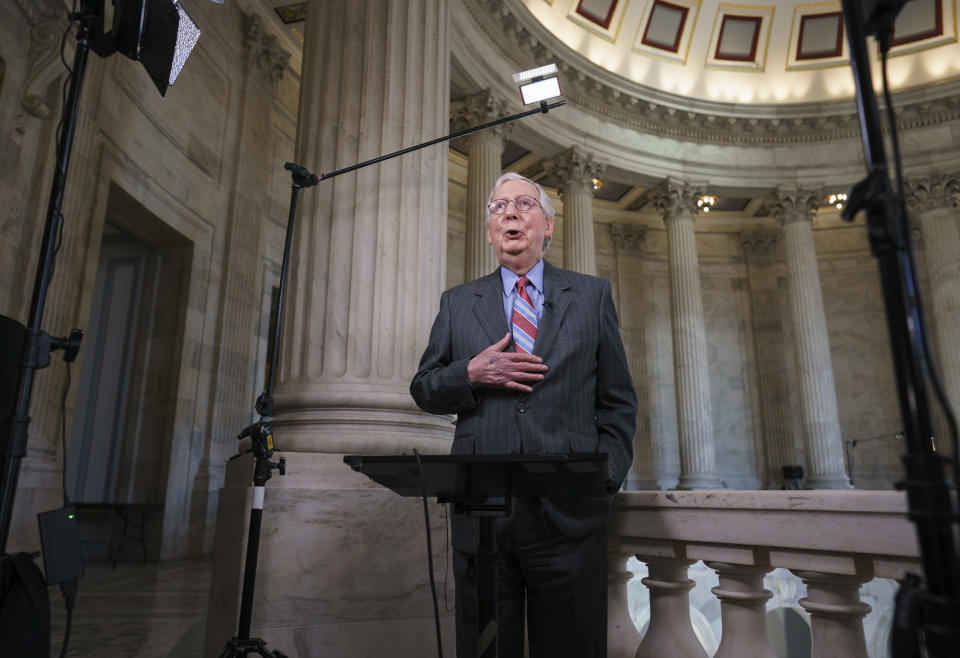 In this June 23, 2021, photo, Senate Minority Leader Mitch McConnell, R-Ky., does a cable news interview before the start of a two-week recess, at the Capitol in Washington. Biden will look to sell voters on the economic benefits of the $973 billion infrastructure package when he travels to Wisconsin on Tuesday, June 29. (AP Photo/J. Scott Applewhite)