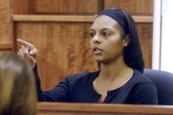 Shaneah Jenkins, the former girlfriend of Odin Lloyd, points to Aaron Hernandez when asked by prosecutor to identify the former New England Patriots football player Aaron Hernandez in the courtroom during his trial in Fall River, Massachusetts January 30, 2015. Witnesses testified on Friday that they saw the apparently lifeless body of a man in an industrial area near Aaron Hernandez's home in June 2013, hours after the former New England Patriots player is accused of committing murder. REUTERS/Ted Fitzgerald/Pool (UNITED STATES - Tags: CRIME LAW SPORT FOOTBALL)