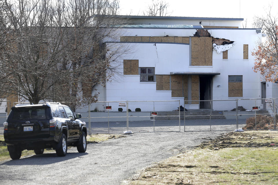 The site of a quadruple homicide and a fire is seen in Colts Neck, N.J., Thursday, Nov. 29, 2018. Prosecutors say financial motives led a New Jersey technology executive to kill his brother, the brother's wife and their young children before setting fire to their two homes. (AP Photo/Seth Wenig)