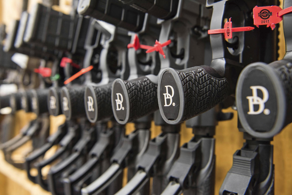 A row of AR-15-style rifles manufactured by Daniel Defense in a vault at the company's headquarters in Black Creek, Ga., in 2017.  (Lisa Marie Pane / AP)