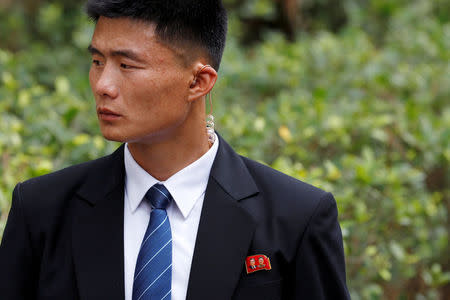 FILE PHOTO: A member of the North Korean security personnel waits for the arrival of North Korea's leader Kim Jong Un at a hotel in Singapore June 10, 2018, ahead of the summit between the North Korean leader and U.S. President Donald Trump. REUTERS/Tyrone Siu/File Photo