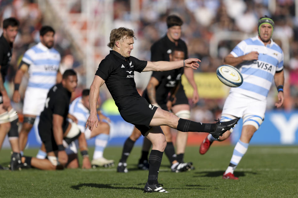 New Zealand's All Blacks Damian Mckenzie kicks a ball during a rugby championship match against Argentina's Los Pumas, at Malvinas Argentinas stadium in Mendoza, Argentina, Saturday, July 8, 2023. (AP Photo/Nicolas Aguilera)