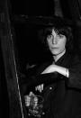 <p>Patti Smith posed backstage before performing with the Patti Smith Group at CBGB's club in New York City on April 4, 1975.</p>