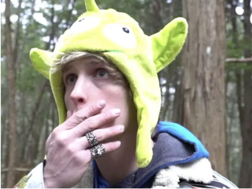 A picture of Logan Paul with his hand over his mouth in shock from the deleted "suicide forest" vlog.