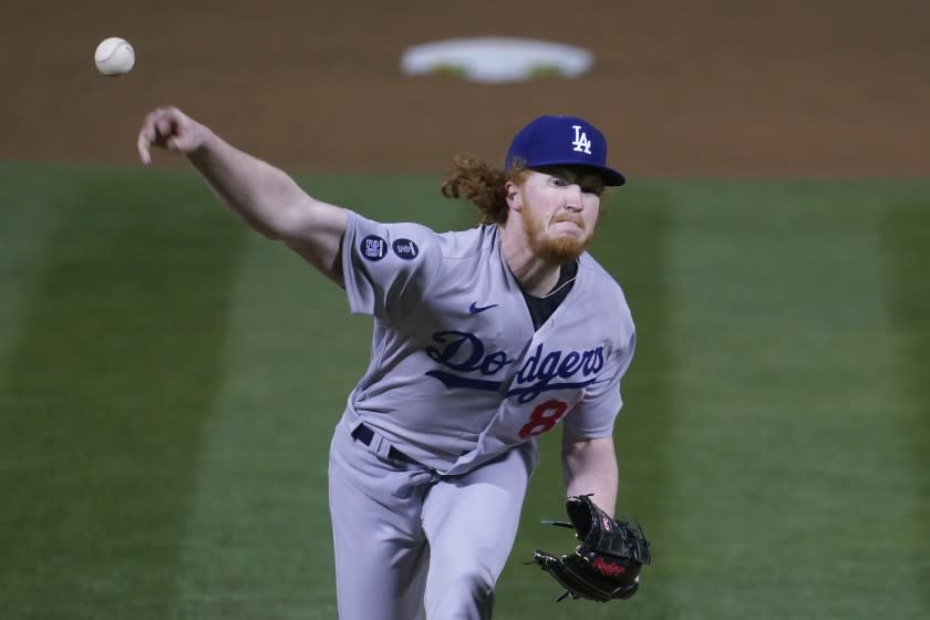 Los Angeles Dodgers pitcher Dustin May throws against the Oakland Athletics during the sixth inning of a baseball game in Oakland, Calif., Monday, April 5, 2021. (AP Photo/Jeff Chiu)
