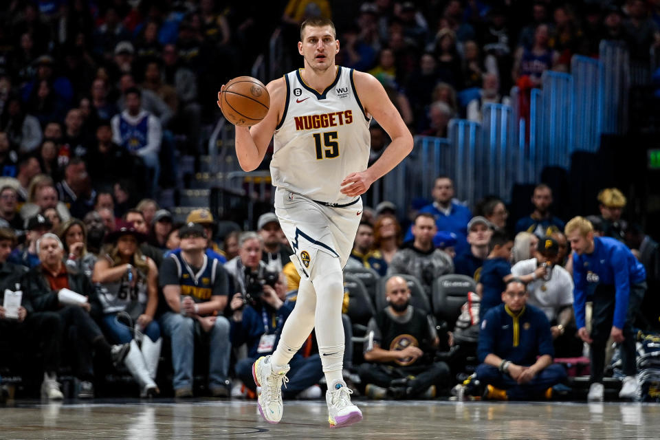 DENVER, CO - MARCH 27:  Nikola Jokic #15 of the Denver Nuggets dribbles against the Philadelphia 76ers in a game at Ball Arena on March 27, 2023 in Denver, Colorado. NOTE TO USER: User expressly acknowledges and agrees that, by downloading and or using this photograph, User is consenting to the terms and conditions of the Getty Images License Agreement. (Photo by Dustin Bradford/Getty Images)