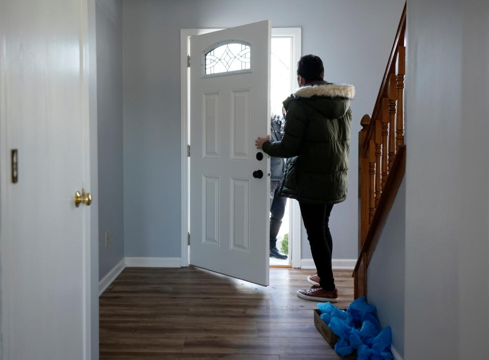 Sinan Falah, an Iraq refugee and real estate agent, opens the door to a home for sale on Sunday, Jan. 14, 2024, in Lewis Center, Delaware County.
