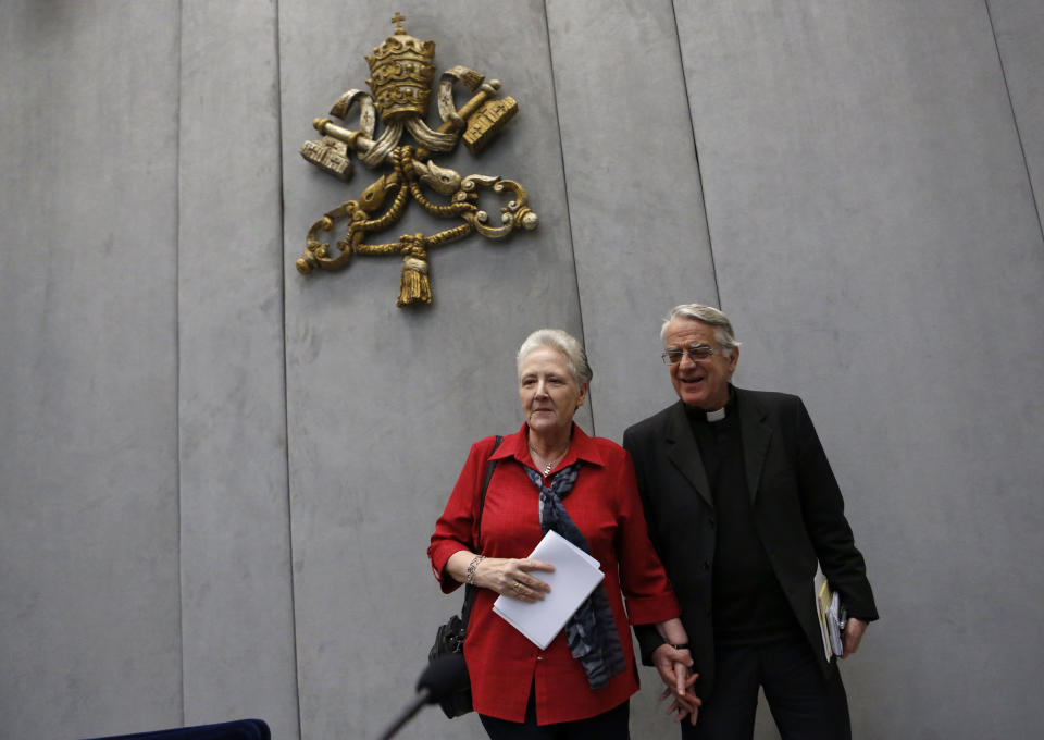 Marie Collins, left, and Vatican spokesman father Federico Lombardi leave at the end of a press conference at the Vatican, Saturday, May 3, 2014. Members of Pope Francis' sexual abuse advisory board say they will develop specific protocols to hold bishops and other church authorities accountable if they fail to report suspected abuse or protect children from pedophile priests. The eight-member committee met for the first time this week at the pope's Vatican hotel to discuss the scope of their work and future members. Marie Collins, a committee member and survivor of sexual abuse, said she came away from the inaugural meeting of the commission "hopeful." (AP Photo/Riccardo De Luca)