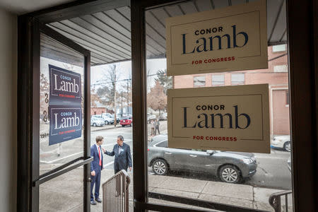 Congressional candidate Conor Lamb meets Jon "Bowzer" Bauman outside of a campaign event in Carnegie, Pennsylvania, U.S., February 16, 2018. Picture taken February 16, 2018. REUTERS/Maranie Staab