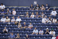 Fans watch during the fourth inning of a spring baseball game between the New York Yankees and the Toronto Blue Jays at George M. Steinbrenner Field, Sunday, Feb. 28, 2021, in Tampa, Fla. (AP Photo/Frank Franklin II)