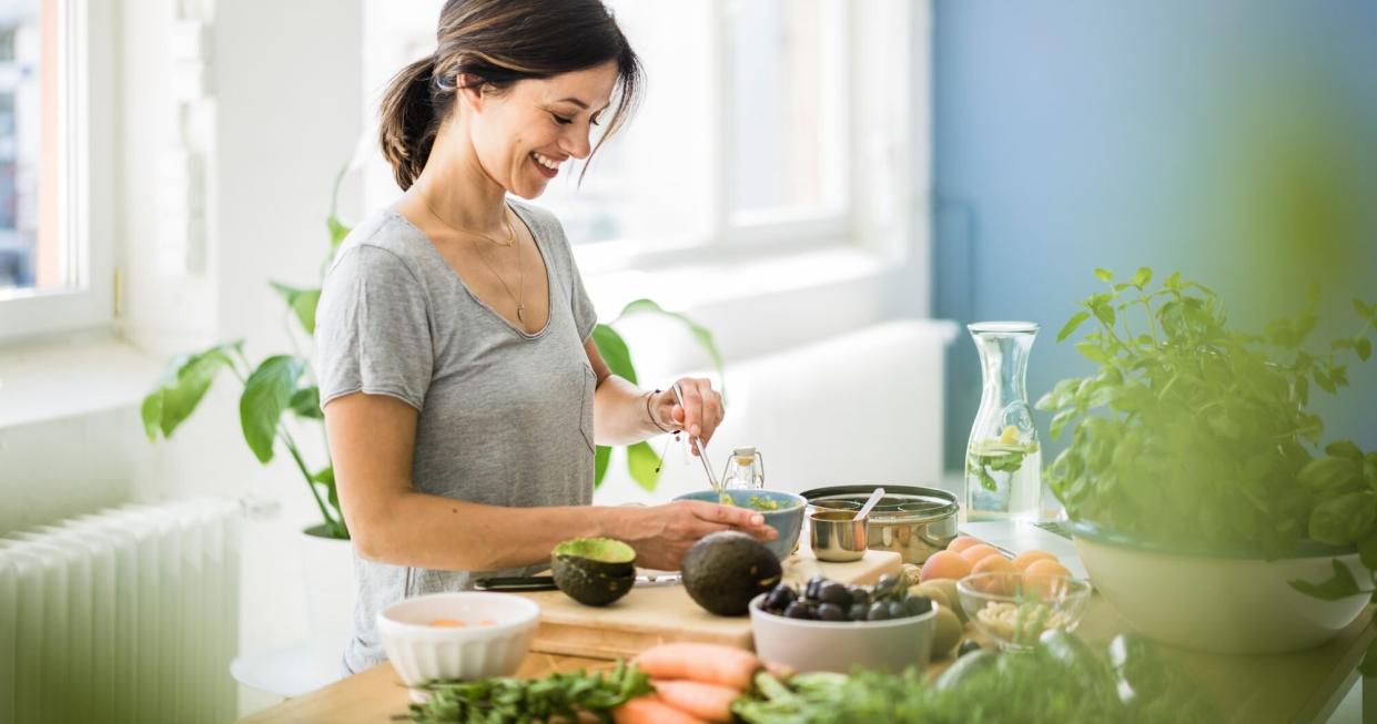 Woman_Preparing_Healthy_Meal_In_Kitchen