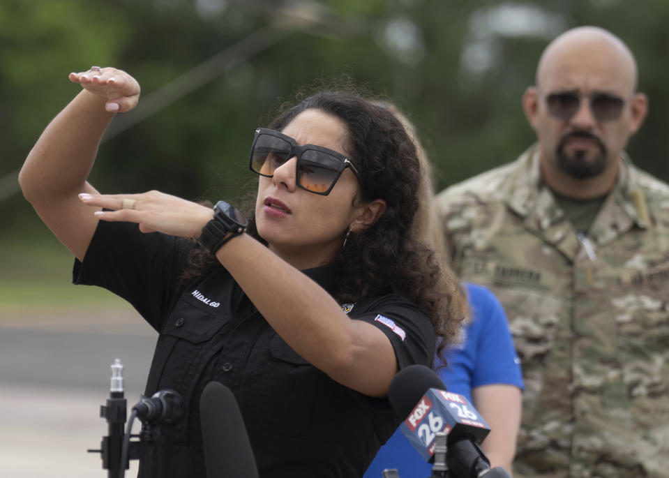 Harris County Judge Lina Hidalgo describes seeing power lines relative to floodwater before going up in a helicopter at David Wayne Hooks Memorial Airport to survey flood damage around the northern section of greater Houston, Saturday, May 4, 2024, in Spring, Texas. (Jason Fochtman/Houston Chronicle via AP)