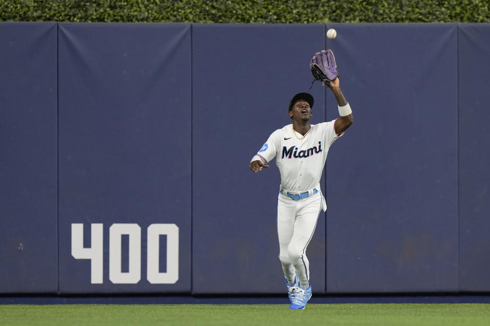 Miami Marlins center fielder Jazz Chisholm Jr. catches a ball hit by Tampa Bay Rays' Brandon Lowe during the first inning of a baseball game, Tuesday, Aug. 29, 2023, in Miami. (AP Photo/Wilfredo Lee)