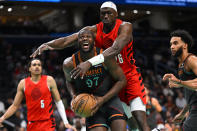 Washington Wizards forward Eugene Omoruyi (97) is found by Portland Trail Blazers center Duop Reath during the first half of an NBA basketball game Friday, April 5, 2024, in Washington. (AP Photo/John McDonnell)