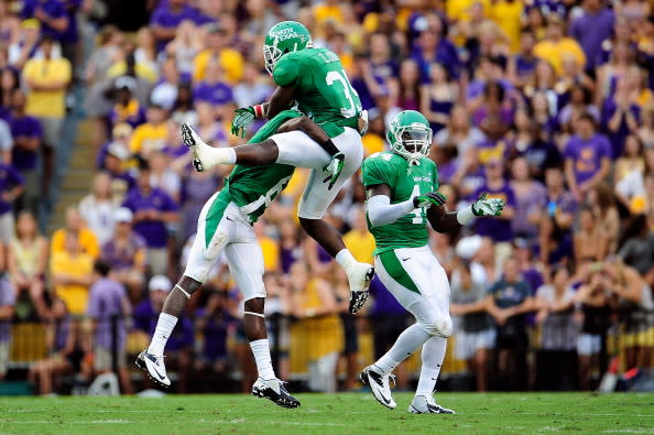Zachary Orr #35 of the North Texas Mean Green celebrates a sack with teammates during a game against the LSU Tigers at Tiger Stadium on September 1, 2012 in Baton Rouge, Louisiana. LSU would win 41-14. (Photo by Stacy Revere/Getty Images)
