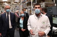 French President Emmanuel Macron visits a factory of manufacturer Valeo, in Etaples