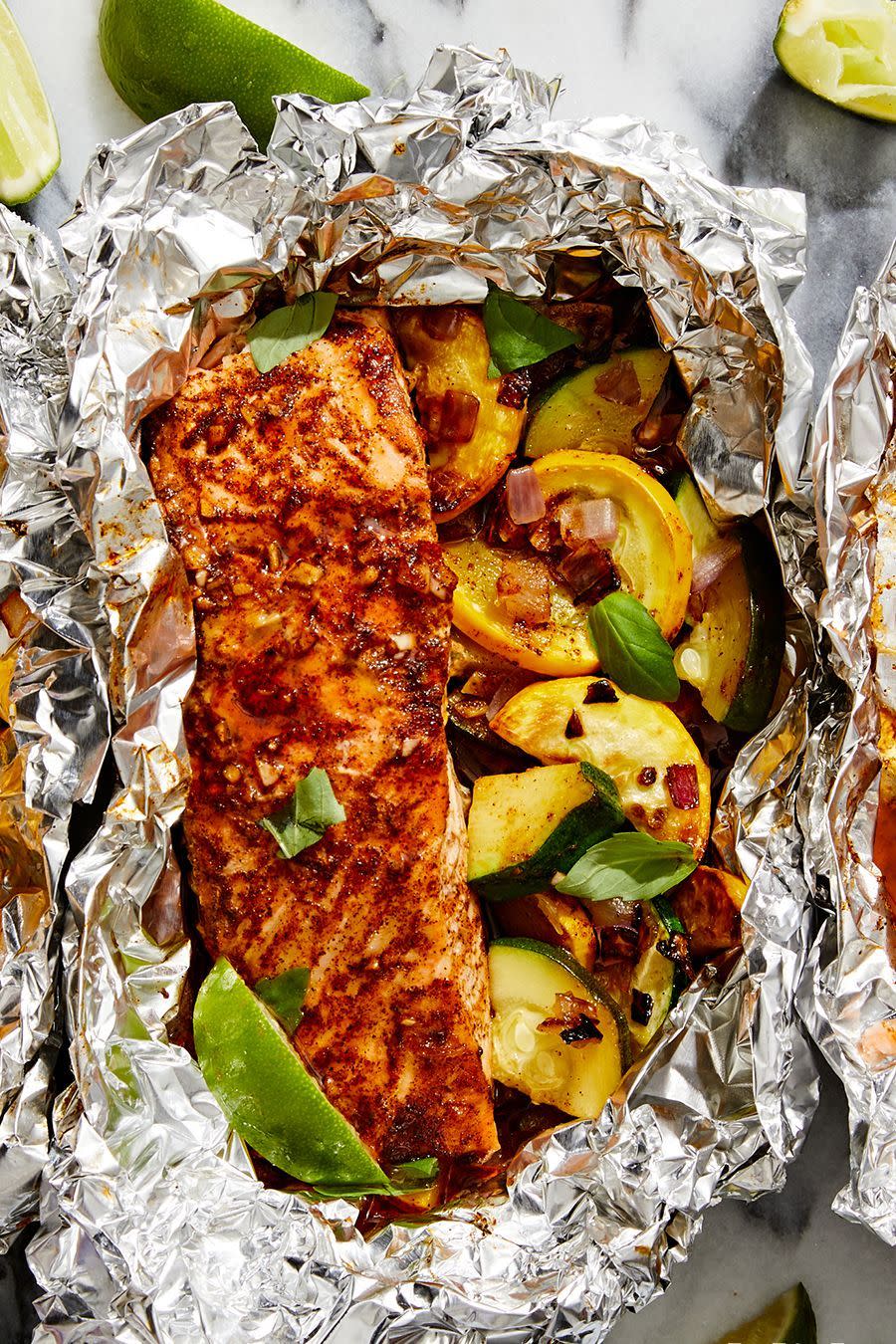<p><a href="https://www.delish.com/cooking/recipe-ideas/g3359/grilled-salmon/" rel="nofollow noopener" target="_blank" data-ylk="slk:Grilling salmon;elm:context_link;itc:0;sec:content-canvas" class="link ">Grilling salmon</a> <em>can</em> be intimidating, but with <a href="https://www.delish.com/cooking/recipe-ideas/g2854/foil-pack-recipes/" rel="nofollow noopener" target="_blank" data-ylk="slk:foil packs;elm:context_link;itc:0;sec:content-canvas" class="link ">foil packs</a>, there's no need to stress. Instead, fold your fish and <a href="https://www.delish.com/cooking/g4080/summer-squash-recipes/" rel="nofollow noopener" target="_blank" data-ylk="slk:summer squash;elm:context_link;itc:0;sec:content-canvas" class="link ">summer squash</a> medley into a tin foil packet, then drizzle it all with the smoky honey-chipotle sauce. Put them on the grill, and in less than 15 minutes, you'll have the <em>easiest</em> dinner, with no mess!<br><br>Get the <strong><a href="https://www.delish.com/cooking/recipe-ideas/a40511179/grilled-honey-chipotle-salmon-foil-packets-with-summer-squash/" rel="nofollow noopener" target="_blank" data-ylk="slk:Grilled Honey-Chipotle Salmon Foil Packets with Summer Squash recipe;elm:context_link;itc:0;sec:content-canvas" class="link ">Grilled Honey-Chipotle Salmon Foil Packets with Summer Squash recipe</a></strong>.</p>