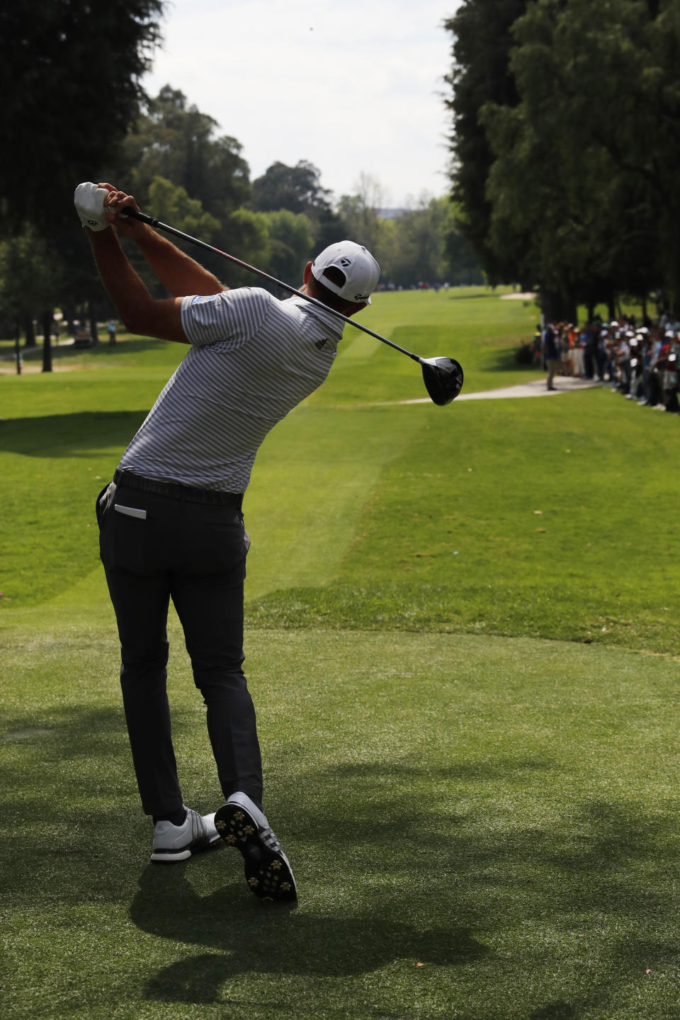 Dustin Johnson tee's off on the 5th hole during the third round of competition of the WGC-Mexico Championship at the Chapultepec Golf Club in Mexico City, Saturday, Feb. 23, 2019. (AP Photo/Marco Ugarte)