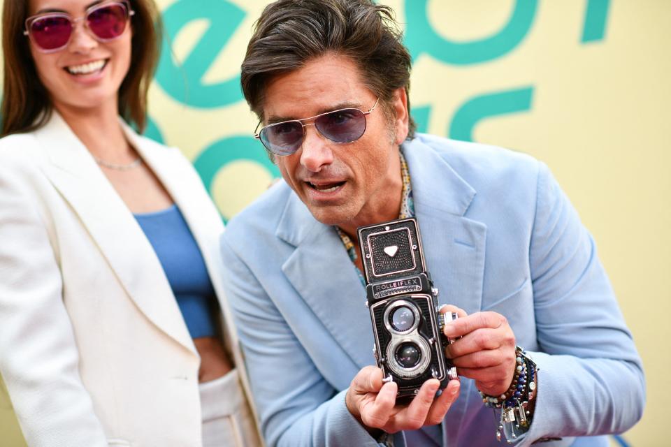 Caitlin McHugh Stamos and John Stamos at the premiere of "The Beach Boys" documentary.