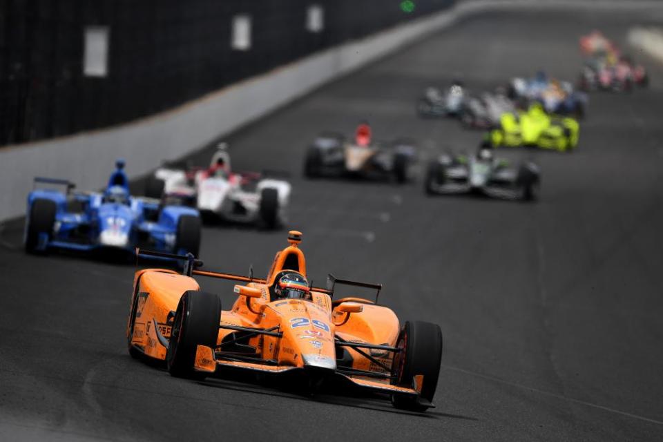 Fernando Alonso, in his McLaren-Honda-Andretti Honda, leads a pack of cars during the 101st Indianapolis 500 in 2017.