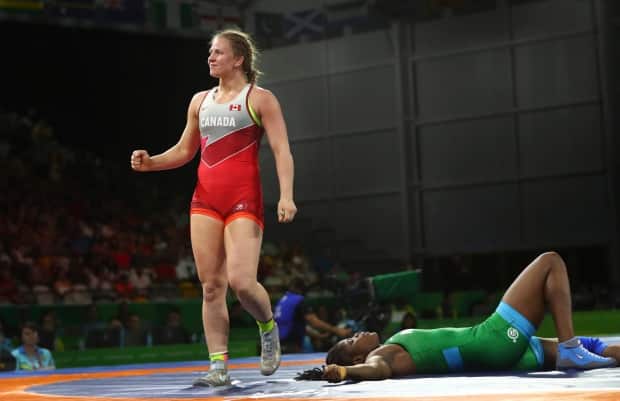 Canada's Erica Wiebe's, above, loss to Aiperi Medet Kyzy of Kyrgyzstan means she will compete for bronze at the Outstanding Ukrainian Wrestlers and Coaches Memorial tournament. (Manish Swarup/The Associated Press/File - image credit)