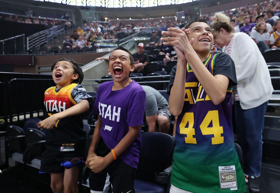 Utah Jazz fans Adam Carrillo, Xavier Leon and Evan Carrillo applaud during a draft fan event in Salt Lake City on Thursday, June 22, 2023 during the NBA draft. | Jeffrey D. Allred, Deseret News