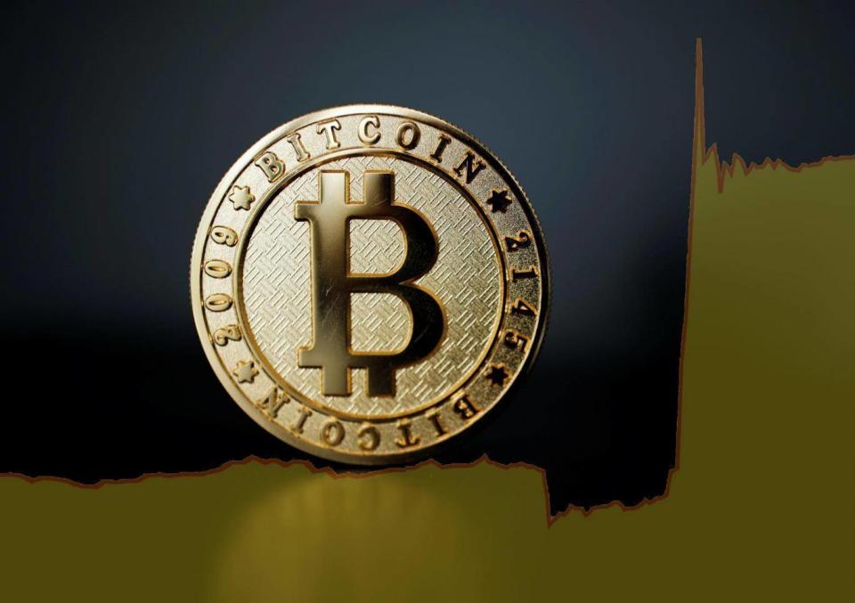 The price of bitcoin experienced unprecedented gains after more than a billion dollars was traded in just one hour. (REUTERS/Benoit Tessier/ Composite)