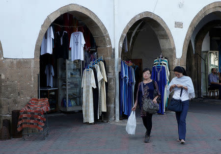 Chinese tourists walk in a tourist shopping area in Casablanca, October 6, 2016. REUTERS/Youssef Boudlal