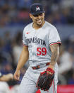 Minnesota Twins pitcher Jhoan Duran (59) reacts after the eighth inning of the team's baseball game against the Toronto Blue Jays on Friday, May 10, 2024, in Toronto. (Cole Burtson/The Canadian Press via AP)